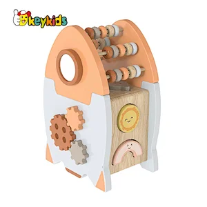Educational Montessori wooden rocket shaped activity cube for children or toddlers W12D448