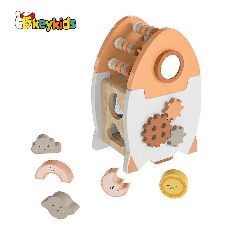 Educational Montessori wooden rocket shaped activity cube for children or toddlers W12D448